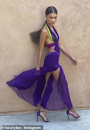 Taking her time: The slow-motion video emphasized her sheer purple skirt billowing in the breeze