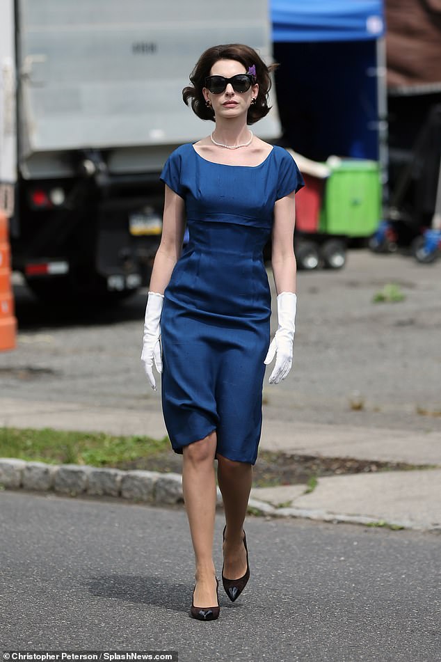 Blue mood: Anne's costume dress was contrasted with black heels, white gloves and chunky black sunglasses