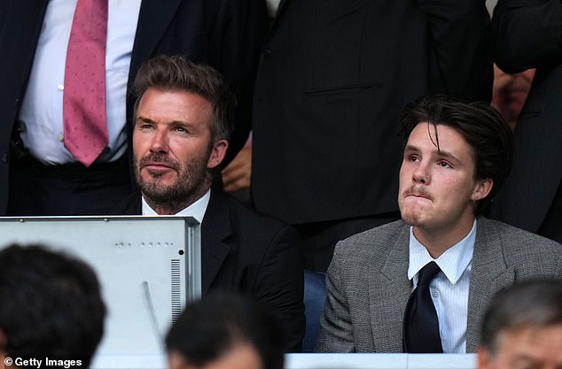 Doting father: David Beckham took his son Cruz to watch Man City vs Real Madrid in the UEFA Champions League semi-final first-leg on Tuesday