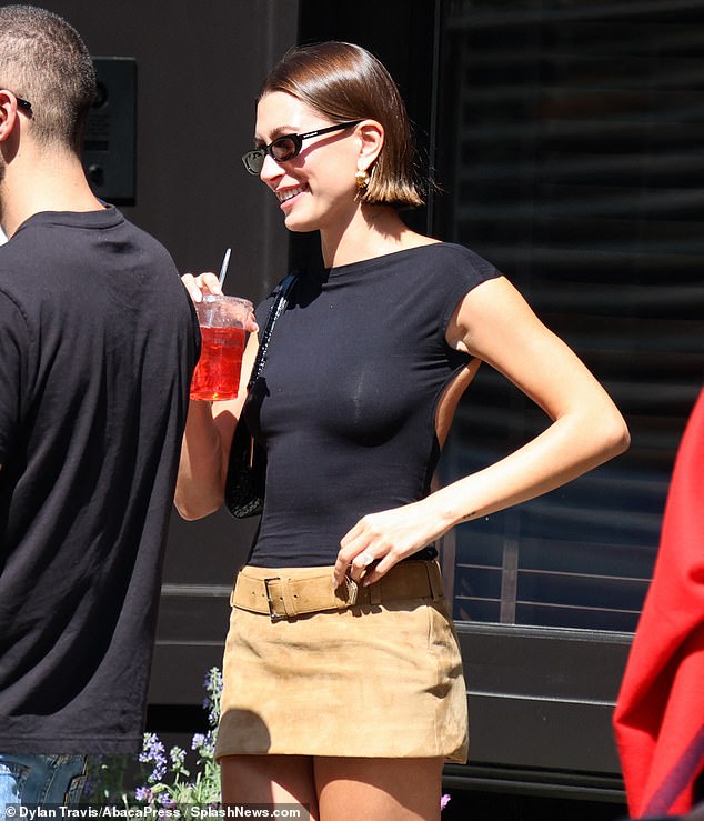 Finishing the look: The entrepreneur contrasted the color of her top with bright white socks and wore a pair of leather shoes