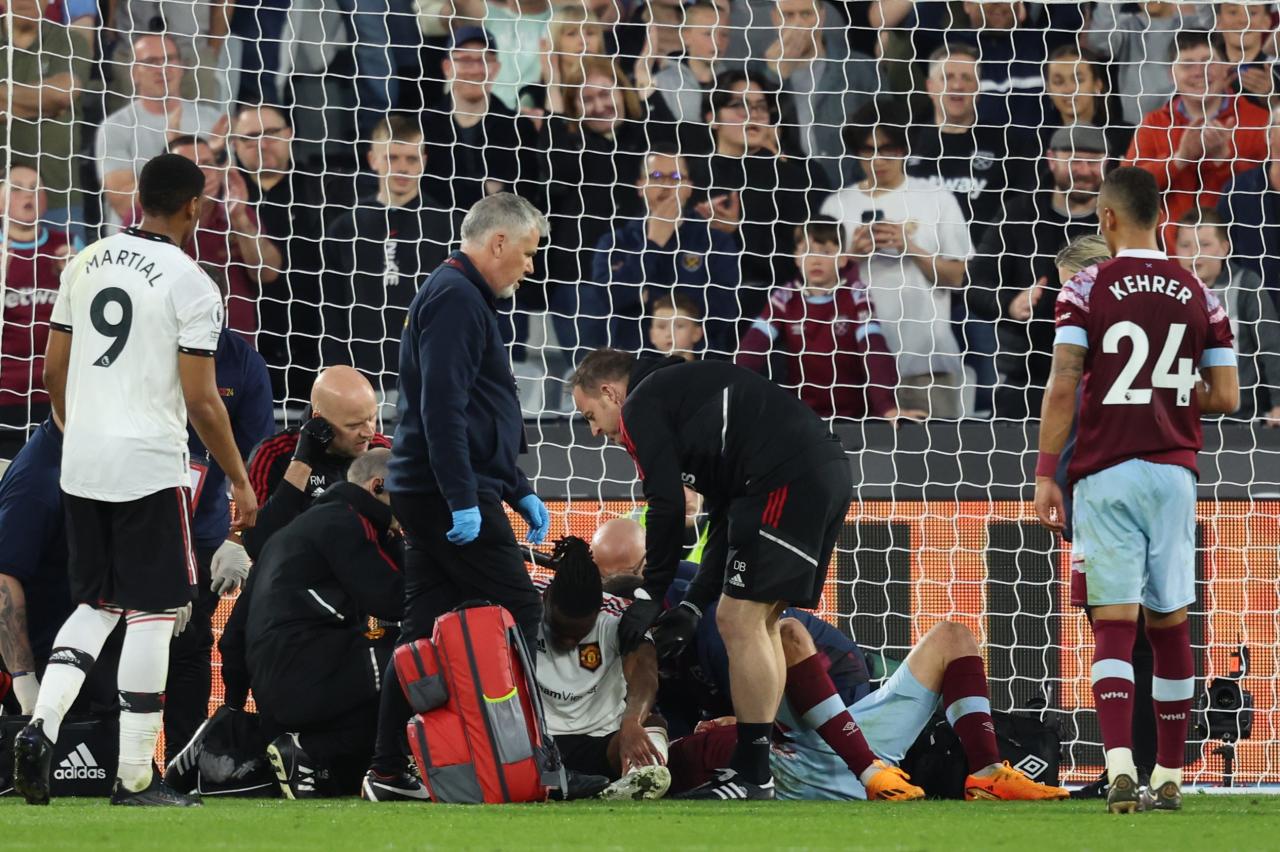 Wan-Bissaka and Soucek surrounded by doctors after horror head clash as fans can't believe they were allowed to play on | The Irish Sun