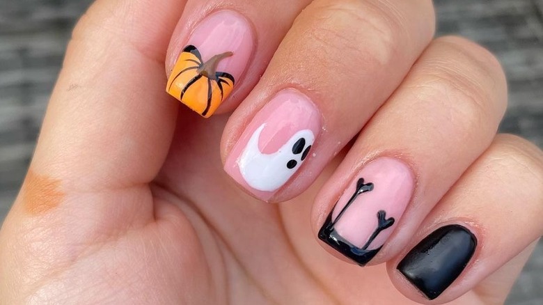 Nails painted with Halloween designs