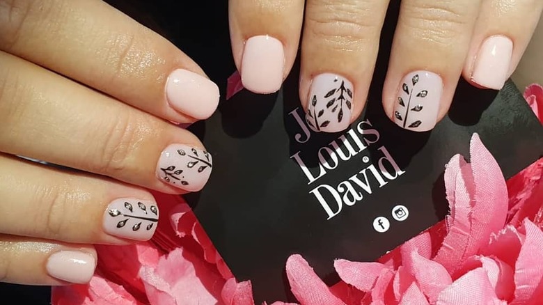 Pink nails with black accents